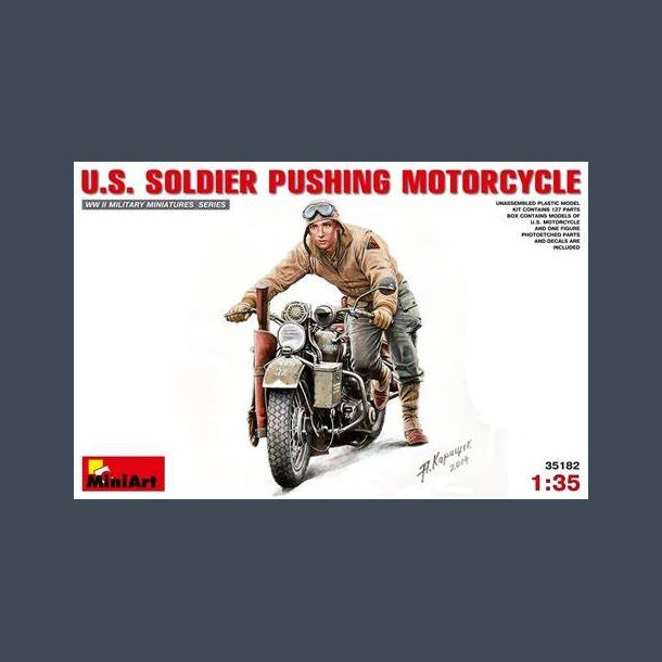 U.S. SOLDIER PUSHING MOTORCYCLE